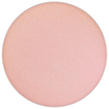 A round, light pink makeup blush or powder. Smooth, matte surface with subtle texture.