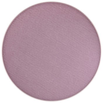 A round makeup eyeshadow in a light pink shade.