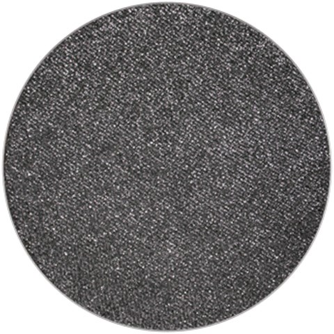 A round, black textured surface with tiny white specks across it. Looks like a close-up of a rough, dark material.
