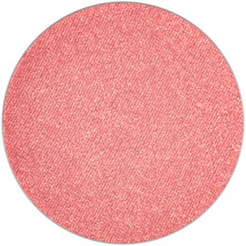 A round, pink, textured cosmetic blush or eyeshadow with no visible brand or label.