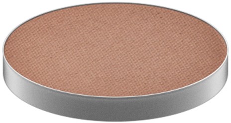 A round, flat makeup blush with a peachy color and a silver rim.
