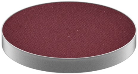 A round makeup blush with a maroon color inside and a silver rim around.