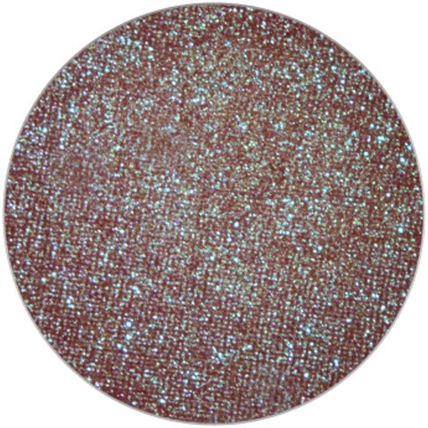 A round, glittery surface with many tiny, shiny, colorful particles. It looks sparkly and bright.