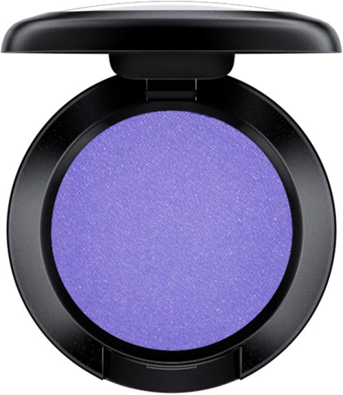 A round purple eyeshadow in a black compact with a lid.
