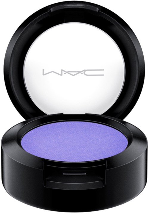 A small round container with purple eyeshadow inside and a lid that has a logo on it.