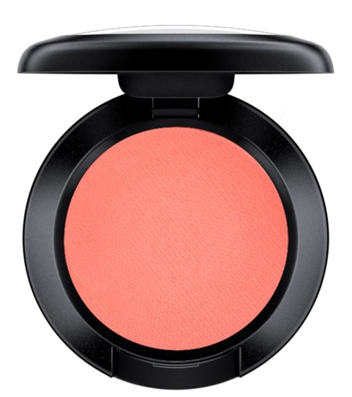 A round blush in a black compact with a lid, pink color inside. No text or branding visible.