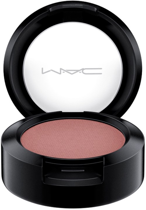 A round makeup blush compact with a pink blush inside and a black outer case.