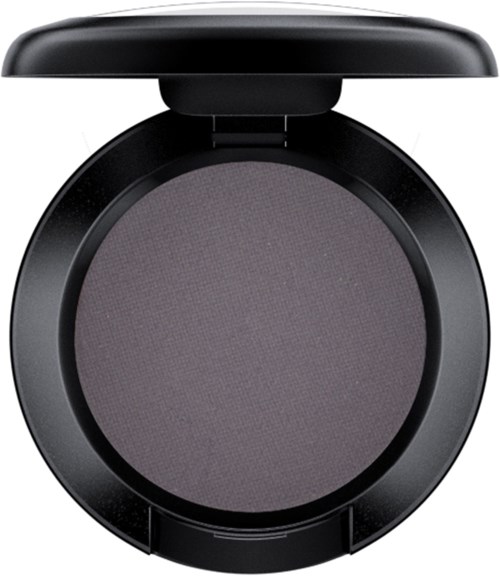 A round, black makeup compact with a flip lid, holding dark grey powder inside.