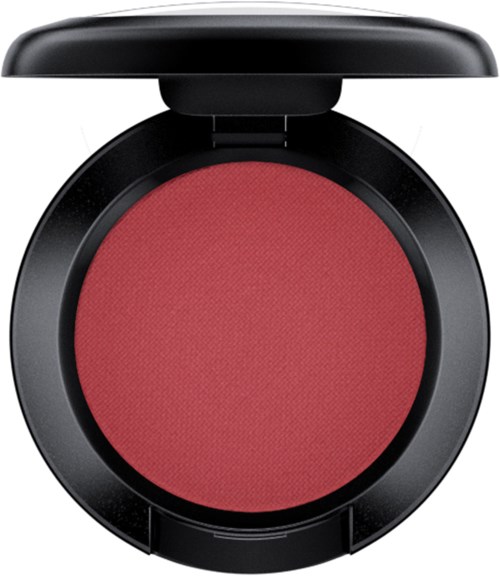 A round red blush compact with a black case and a lid open.