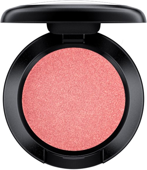 A round, pink blush in a black compact with a hinged lid. The blush has a shimmery, textured surface.