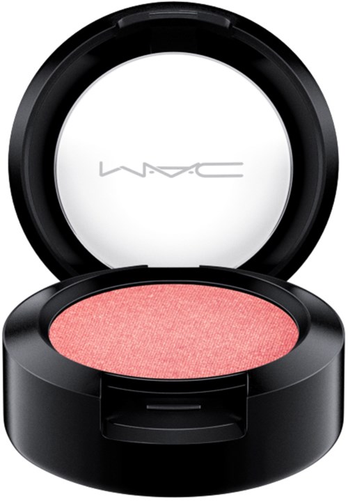 A round blush container with an open lid showing pink blush inside and "MAC" written on the inside of the lid.