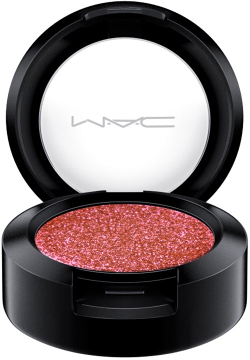 En rund makeup blushbehållare med rosa, glitterig blush inuti och en spegel i locket.