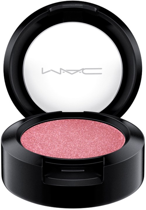 A black round container with a pink, shimmery eyeshadow inside and MAC logo on the lid.