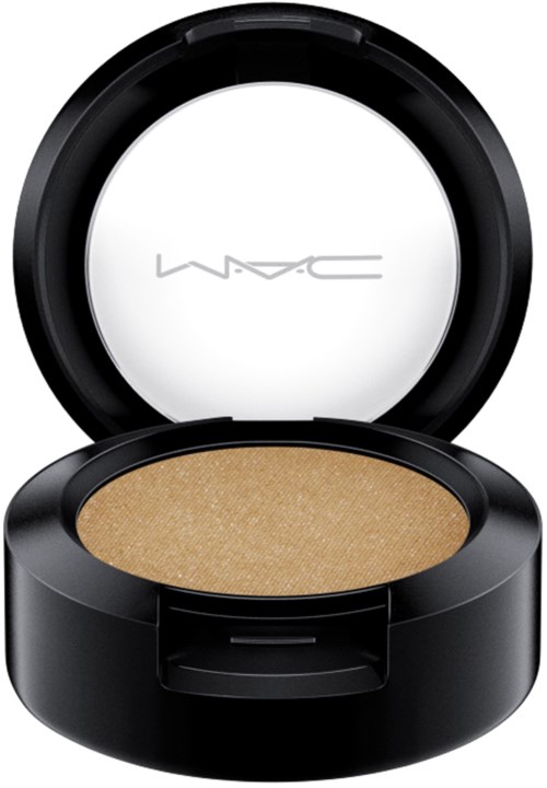 This is a makeup product container with a round, black case and a beige cosmetic inside.