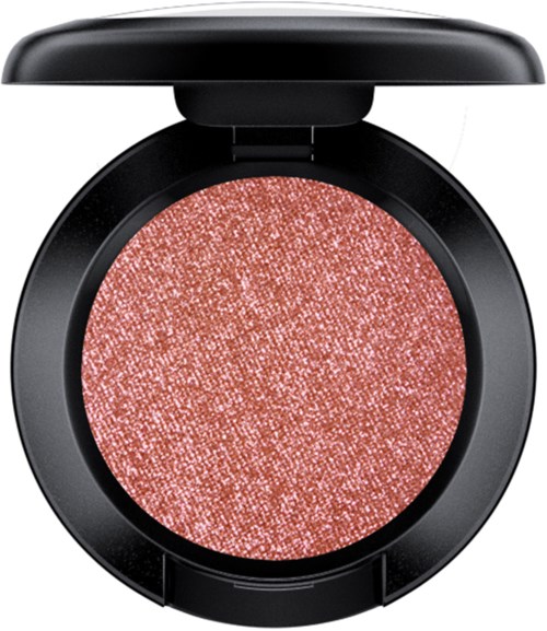 A round eyeshadow in a black compact case, with a shimmering pinkish hue.