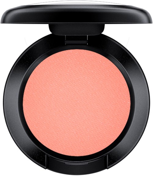 A pink blush in a round black compact with a lid, no brush present.
