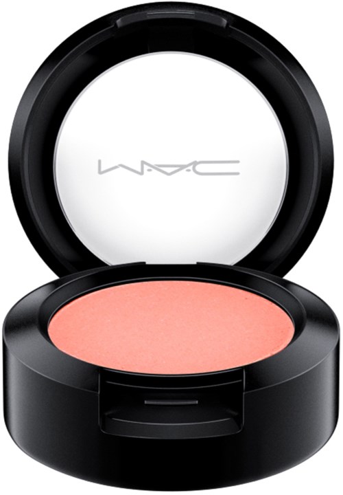 A round makeup compact with pink blush, black outer case, and an open lid showing the brand logo MAC inside.