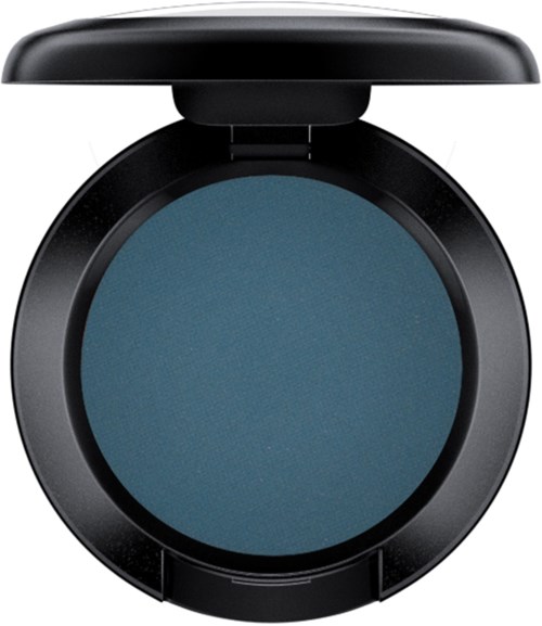 A blue eyeshadow in a round black compact case with a lid open. Simple and sleek design.