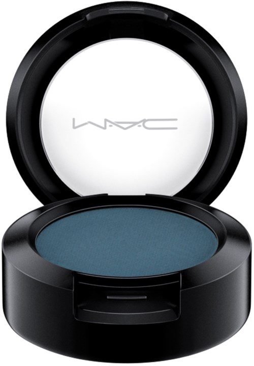 A MAC makeup product with blue eyeshadow inside a black round container.