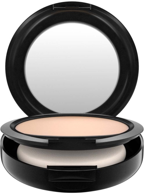 En liten sminkprodukt med en rund spegel på toppen och ett beige pulver inuti.