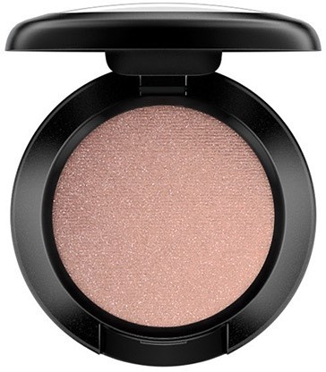 A round makeup compact with pinkish-beige shimmery pressed powder inside.