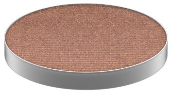 A circular makeup powder with a silver edge and light brown surface.