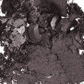 En abstrakt svart och grå mönster med grova, texturerade fläckar och virvlande former.