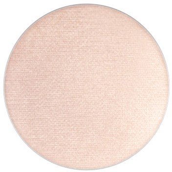 En ljus, beige rund pudercompact, kanske för smink, med en slät texturerad yta.