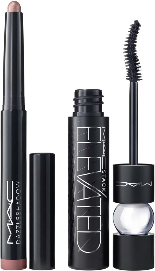 Four makeup items: a nude lipstick, a black lash mascara, a primer or setting spray, and a clear lip gloss.