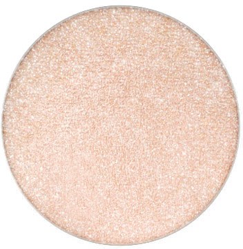 En rund, glitterig, persikofärgad yta med ett glittrande, glansigt utseende.