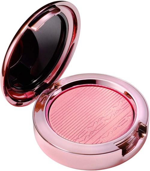 En rosa compact med en rouge inuti, har en spegel på locket och ett räfflat mönster på rougen.