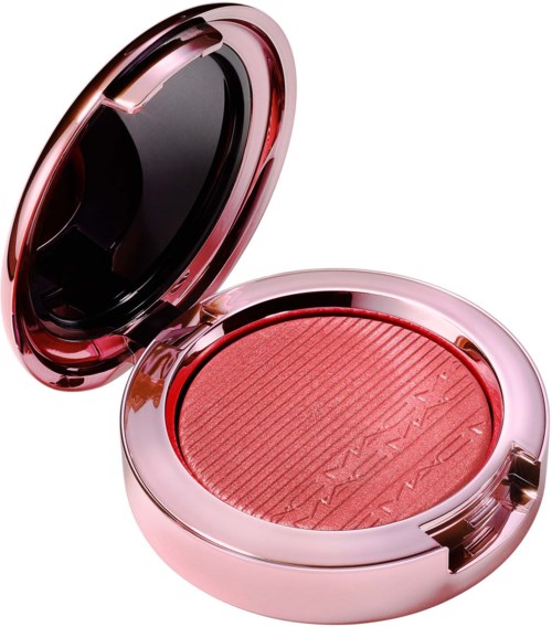 Ljusrosa compact med rosa rouge och svart spegel på locket.