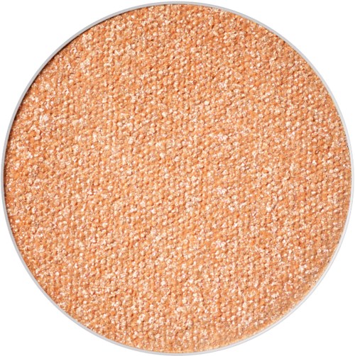A round makeup product with a peach-colored, shimmery, powdered surface.