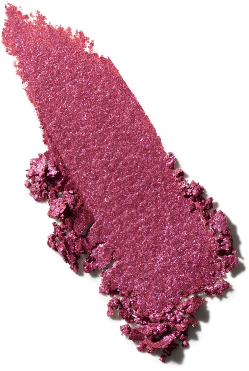 Pink eyeshadow with a rough, crumbly edge. It is a loose, powdery makeup product.
