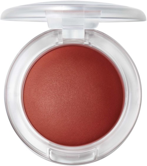 A round makeup compact with reddish-brown eyeshadow inside and a clear lid.