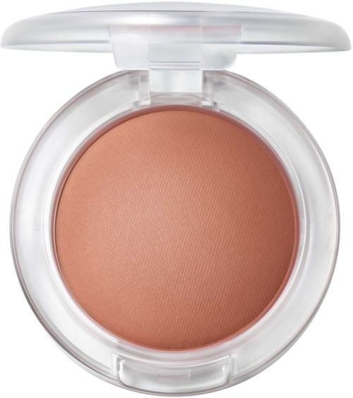 A round compact with peach-colored makeup, a transparent lid, and a hinge on top.
