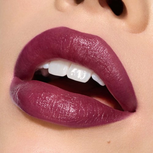 Close-up of glossy, dark pink lips slightly parted, showing white teeth and part of the tongue.