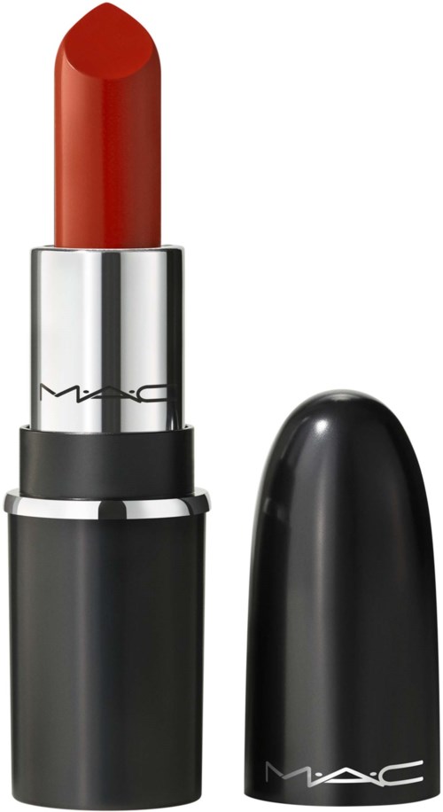Red lipstick in a silver and black tube, with the cap removed. The cap is placed beside it.