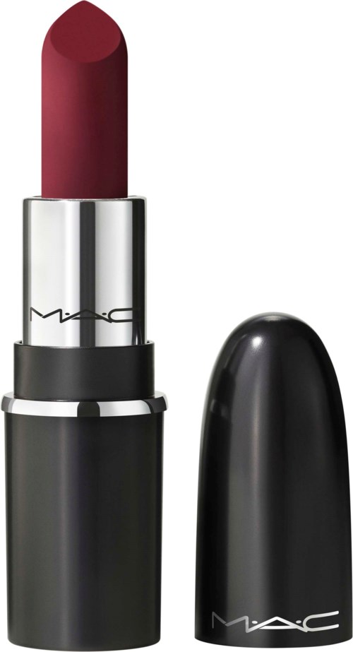 Red lipstick in a black tube with a silver band, cap removed, showing the lipstick.