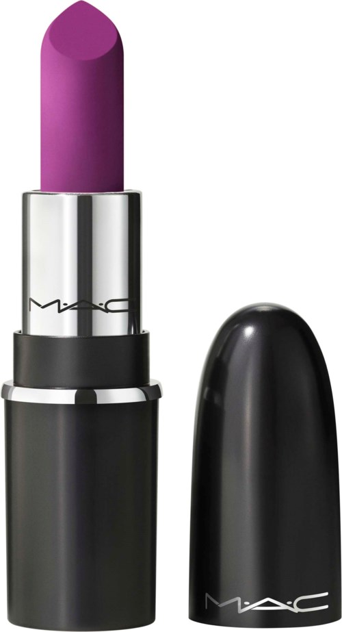 A MAC lipstick with a purple shade, silver tube, and black cap placed beside.