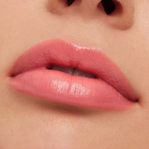 Close-up of pink, shiny lips slightly parted, showing teeth.