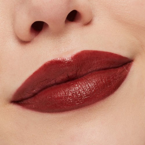 Close-up of lips with dark red lipstick and part of the nose visible.