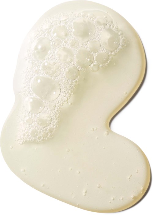 A white kidney-shaped object with bubbles on its surface, looks like a piece of cheese or soap.
