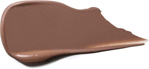 Een staaltje bruin make-up of concealer met een glad, glanzend oppervlak en een taps toelopende rand.