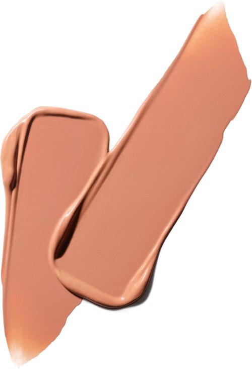 Eine beige, cremige Substanz ist in einer dicken Linie verstreut, mit glatten, gebogenen Rändern vor weißem Hintergrund.