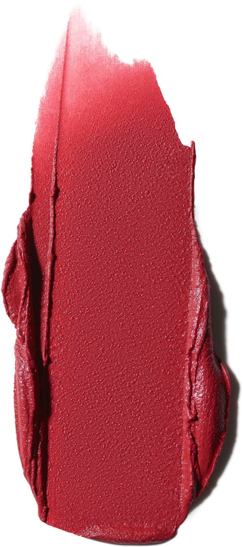A smudged red lipstick mark on a white surface.