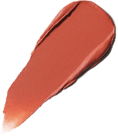 A swatch of peach-colored lipstick with a smooth texture and a slightly shiny finish.