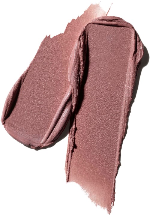 Two pieces of pinkish makeup or lipstick smudged on a white surface.