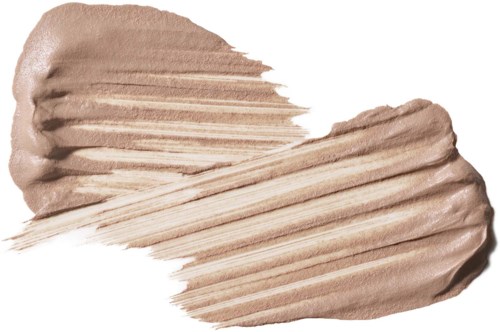 Kremfarget makeup-sverging med en glatt, noe teksturert overflate.