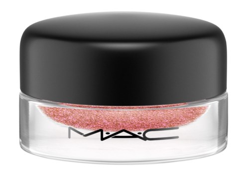 A small container with a black lid and pink glitter inside, labeled 'M·A·C' on the glass.